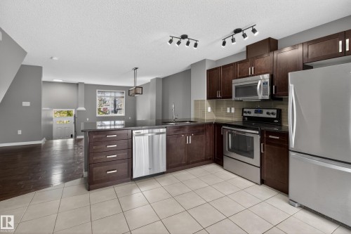 11 1140 Chappelle Boulevard, Edmonton, AB - Indoor Photo Showing Kitchen With Stainless Steel Kitchen