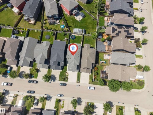 Aerial view showcasing a residential property with a gray shingle roof and a private fenced yard - 8516 216 Street, Edmonton, AB 