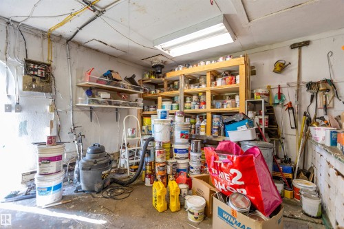 Utility room with concrete flooring, exposed wiring, and wall-mounted shelving - 551027 Range Road 193, Rural Lamont County, AB 