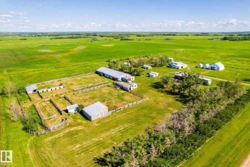 Expansive rural property featuring multiple outbuildings, fenced enclosures, open fields, and scattered trees - 551027 Range Road 193, Rural Lamont County, AB 