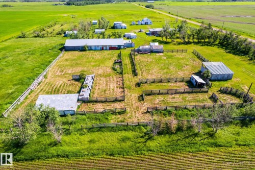 Expansive rural property featuring multiple outbuildings, extensive fencing, and open green spaces - 551027 Range Road 193, Rural Lamont County, AB 