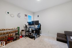 Carpeted room with a single window, recessed lighting, and light-toned walls - 