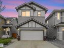 Contemporary two-story residence featuring gray horizontal siding and contrasting white vertical accents - 20507 99 Avenue, Edmonton, AB  - Outdoor 