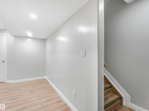 Room featuring wood-finish flooring, recessed lighting, and light grey wall paint - 20507 99 Avenue, Edmonton, AB - Indoor Photo Showing Other Room