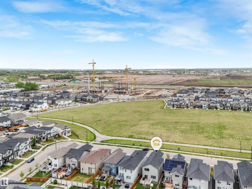 Residential property with a dark shingle roof and solar panels - 20507 99 Avenue, Edmonton, AB - Outdoor With View