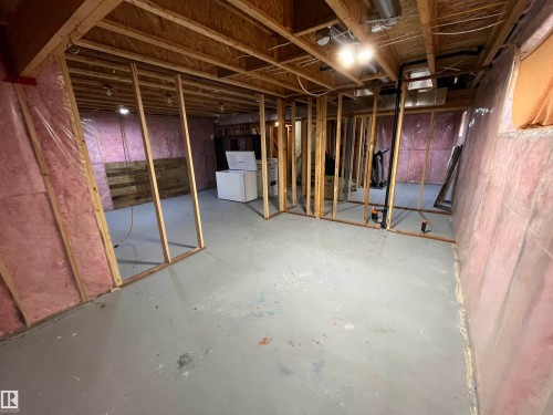 Unfinished basement featuring exposed wood framing, insulated walls, concrete flooring, and exposed ceiling joists - 8 Meadowlink Common, Spruce Grove, AB - Indoor Photo Showing Basement
