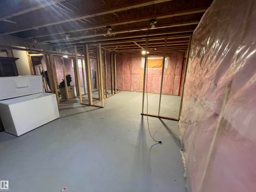 Unfinished basement featuring exposed wood framing, insulated walls, concrete flooring, and exposed ceiling joists - 8 Meadowlink Common, Spruce Grove, AB - Indoor Photo Showing Basement