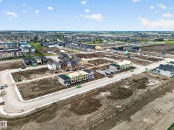 Developing residential area featuring a mix of single-family homes and multi-story apartment buildings - 
