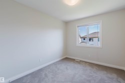 Neutral-toned walls and plush gray carpeting define this interior space - 