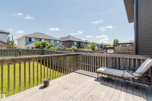 Expansive wooden deck featuring sturdy railings and a spacious surface - 1131 177 Street, Edmonton, AB 