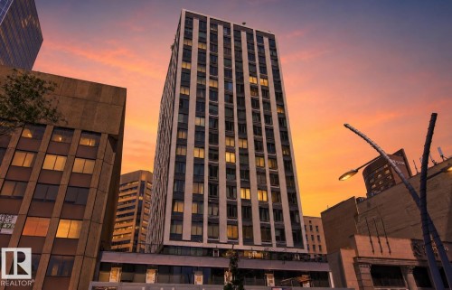 High-rise building with a sleek facade featuring numerous windows - 404 10024 Jasper Avenue, Edmonton, AB 
