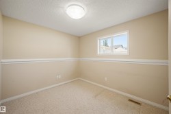 Neutral-toned carpeting paired with beige walls and white trim - 
