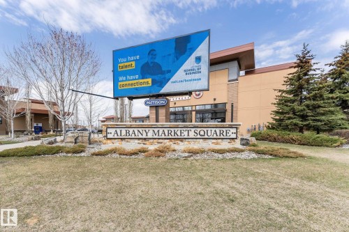 "Albany Market Square" stone monument sign with integrated landscaping - 35 675 Albany Way, Edmonton, AB 