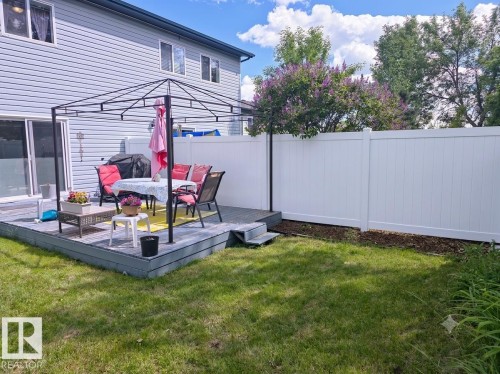 This is an AI generated image that shows what the new fence could look like when replaced this summer. - 12237 140A Avenue, Edmonton, AB 