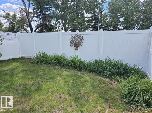 This is an AI generated image that shows what the new fence could look like when replaced this summer. - 12237 140A Avenue, Edmonton, AB 