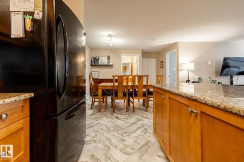Kitchen counter with a granite-style surface - 330 1520 Hammond Gate Gate, Edmonton, AB 