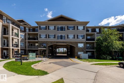 Contemporary multi-story building featuring varied facade materials including stone accents and siding - 330 1520 Hammond Gate Gate, Edmonton, AB 