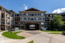 Contemporary multi-story building featuring varied facade materials including stone accents and siding - 330 1520 Hammond Gate Gate, Edmonton, AB 