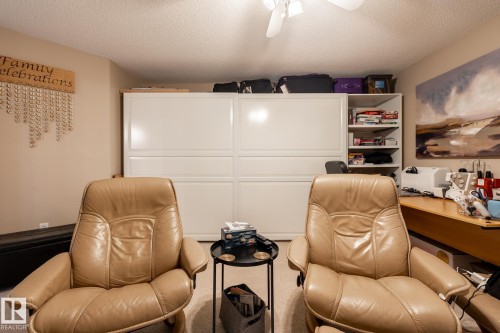 Integrated wall-to-wall white cabinetry with shelving - 330 1520 Hammond Gate Gate, Edmonton, AB 