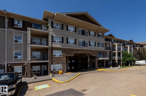 Multi-story residential building featuring a stone and siding exterior - 330 1520 Hammond Gate Gate, Edmonton, AB 