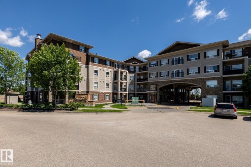 Contemporary multi-story building featuring stone veneer and horizontal siding accents - 330 1520 Hammond Gate Gate, Edmonton, AB 