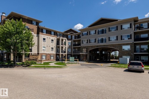 Multi-story building featuring a stone and siding exterior with multiple balconies - 330 1520 Hammond Gate Gate, Edmonton, AB 
