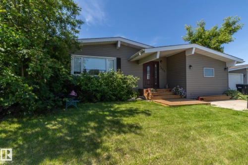 Ranch-style residence featuring a gray siding exterior and a prominent front entrance - 3608 44 Street, Leduc, AB 