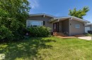 Ranch-style residence featuring a gray siding exterior and a prominent front entrance - 3608 44 Street, Leduc, AB 