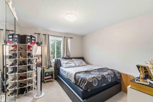 Recessed window with exterior views, light-toned walls, and ceiling-mounted flush lighting fixture - 244 1196 Hyndman Road, Edmonton, AB 