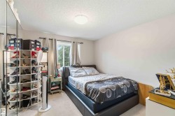 Recessed window with exterior views, light-toned walls, and ceiling-mounted flush lighting fixture - 