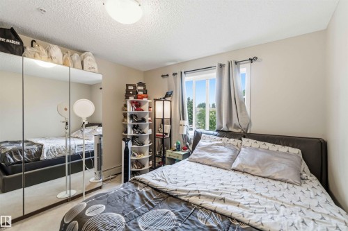 Warm-toned interior walls complement the window with outdoor scenery - 244 1196 Hyndman Road, Edmonton, AB 