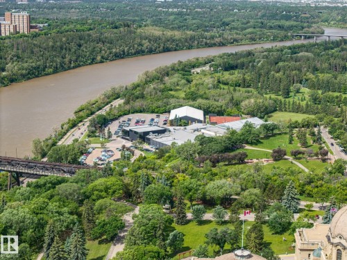 Aerial perspective showcasing a large river, expansive green spaces, and a commercial complex - 802 9720 106 Street, Edmonton, AB 