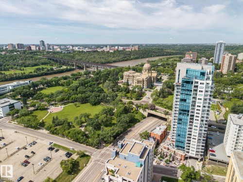 Contemporary high-rise building featuring a sleek glass facade and private balconies - 802 9720 106 Street, Edmonton, AB 
