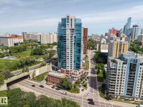 Contemporary high-rise building with a curved glass facade and multiple balconies - 802 9720 106 Street, Edmonton, AB 
