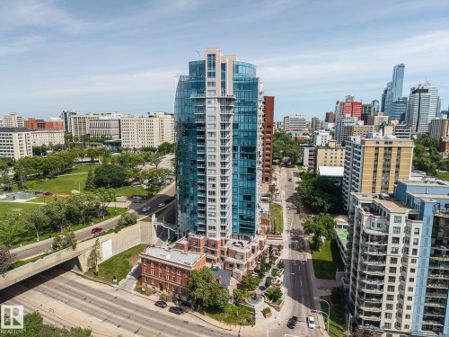 Modern high-rise with a curved glass facade and multiple balconies - 802 9720 106 Street, Edmonton, AB 