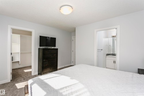 Bedroom featuring light gray wall paint and gray carpet flooring - #55 723 172 St Sw, Edmonton, AB - Indoor Photo Showing Bedroom