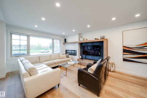 5431 113A Street, Edmonton, AB - Indoor Photo Showing Living Room With Fireplace