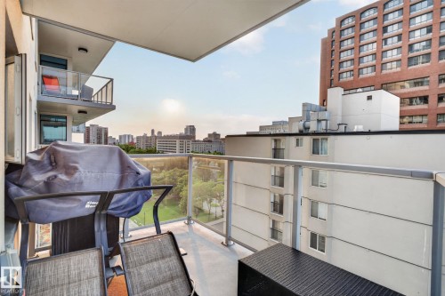 Balcony with glass panel railing and cityscape backdrop - 1504 9720 106 Street, Edmonton, AB 