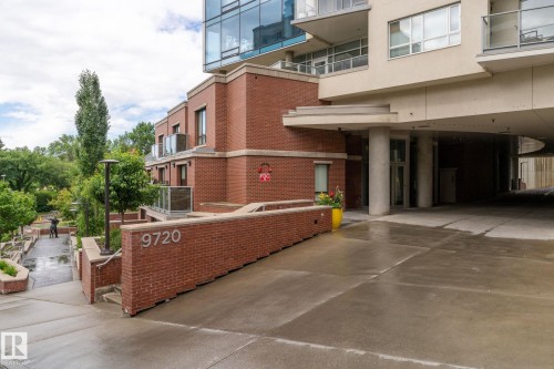 Brick and glass facade with contemporary balconies and concrete entry - 1504 9720 106 Street, Edmonton, AB 