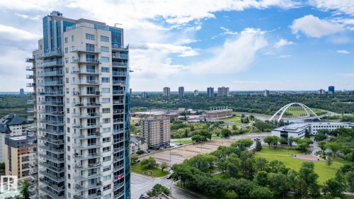 Modern high-rise residential building featuring multiple private balconies with glass railings - 1504 9720 106 Street, Edmonton, AB 