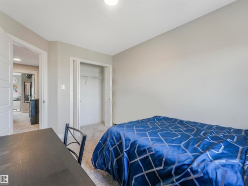 Bedroom featuring soft neutral wall tones and light-toned carpet flooring - 17171 38 Street, Edmonton, AB 