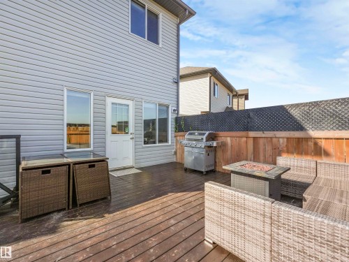 Expansive wooden deck featuring horizontal plank flooring - 17171 38 Street, Edmonton, AB 