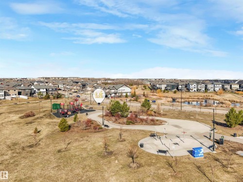 Community park featuring a playground, paved walking paths, and exercise equipment - 17171 38 Street, Edmonton, AB 