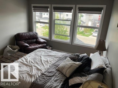 Triple window unit featuring white trim - 138 Reed Place, Leduc, AB 
