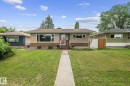 Single-story residence featuring a neutral stucco and brick facade - 12115 53 Street, Edmonton, AB 