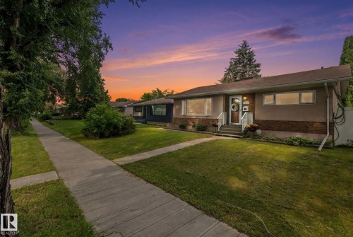 Single-story residence featuring a brown shingle roof and a stucco and brick exterior - 12115 53 Street, Edmonton, AB 