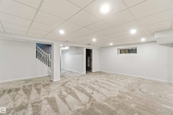Spacious finished lower level featuring recessed lighting, a drop ceiling, and plush patterned carpeting - 