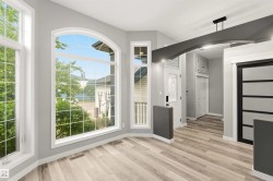 Bay window with an arched top frame and grid panes - 