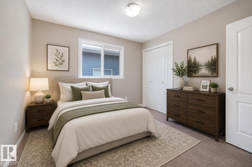 Neutral toned walls, a double window, and carpeted flooring - 1306 32A Street, Edmonton, AB 