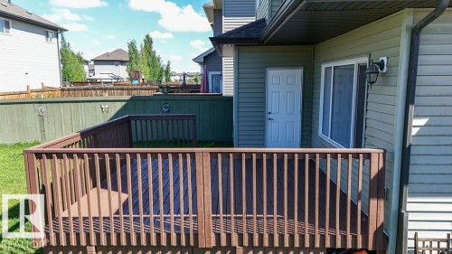 Expansive deck with brown wood-finish flooring and matching railings - 1306 32A Street, Edmonton, AB 